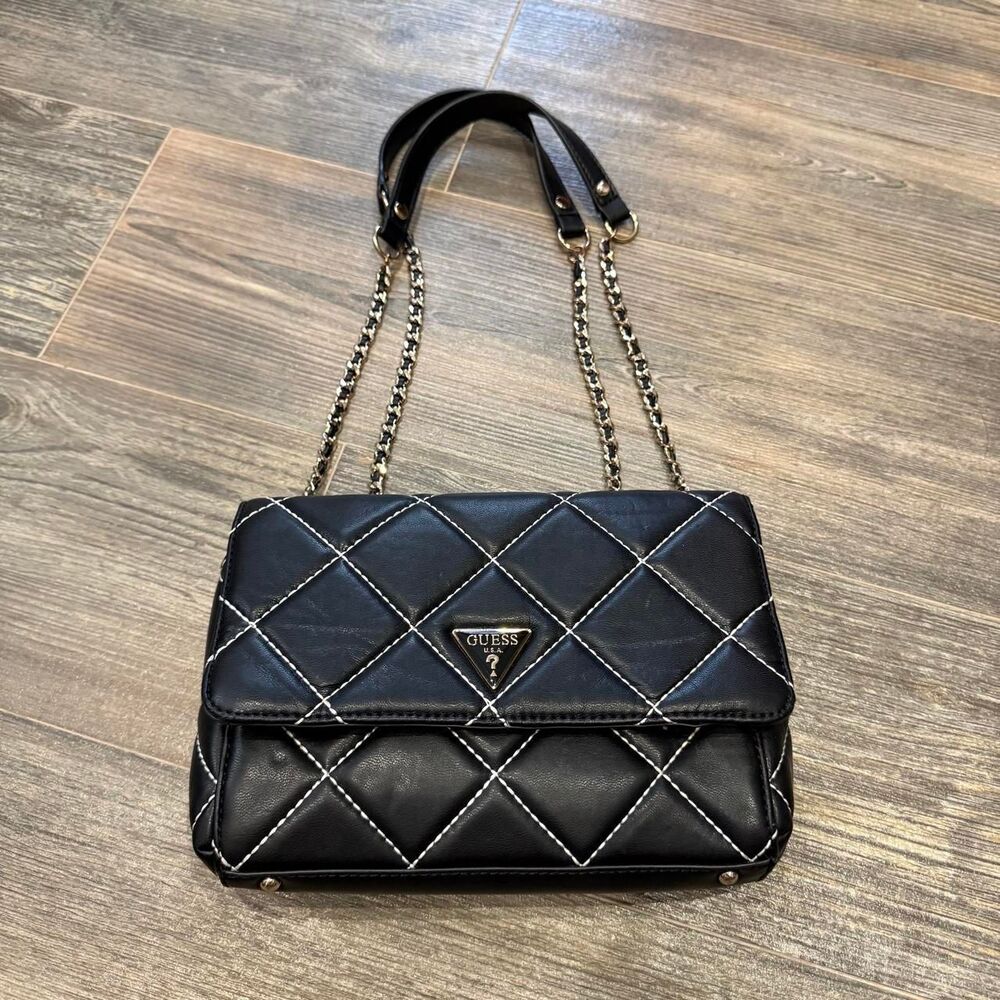 Guess black quilted leather handbag with white stitching and gold chain strap